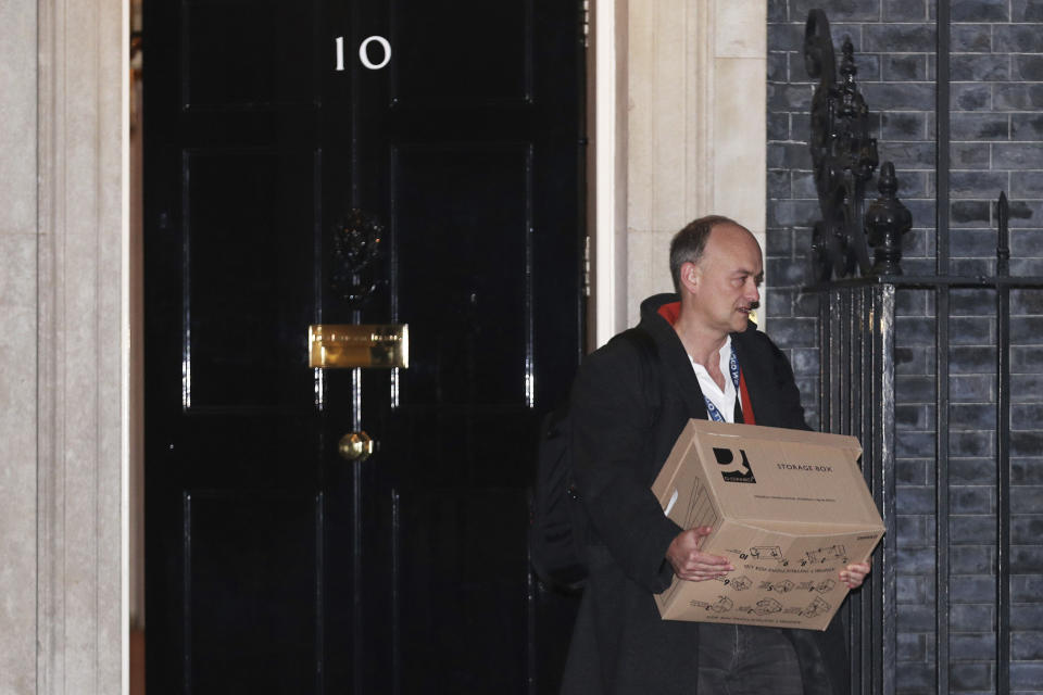 Britain's Prime Minister Boris Johnson's top aide Dominic Cummings leaves 10 Downing Street with a box, in London, Friday, Nov. 13, 2020. Late Wednesday, Lee Cain announced he was quitting as director of communications, a move that has sparked speculation that Dominic Cummings, Johnson's top adviser, could soon leave, further weakening the pro-Brexit camp. Both Cain and Cummings worked together on the 2016 Brexit referendum campaign that was largely fronted by Johnson. (Yui Mok/PA via AP)