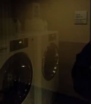 Doug boldly peers into a laundry provoking speculation that the room is haunted. Photo: YouTube