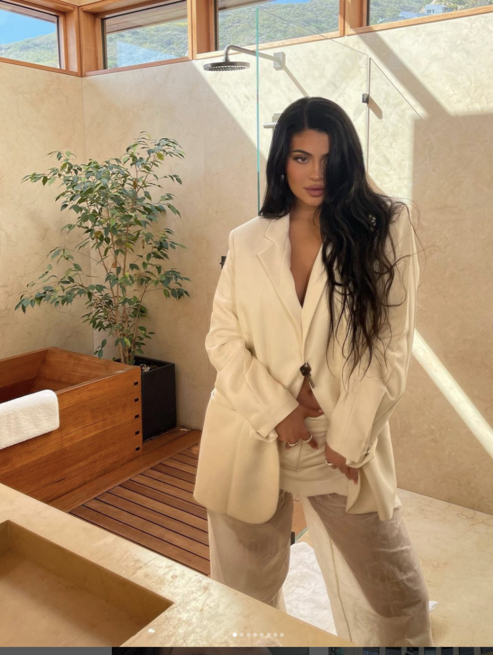 <p>Kylie Jenner made an effortless statement about body positivity when channelling an undone take on a tailored look. </p><p>The mum-of-two, who welcomed her baby boy in February 2022, opted to wear an oversized neutral blazer over a pair of gauzy, skin-baring trousers for an outfit that oozed modern femininity. </p><p>Even her tousled hair suited the nonchalant mood. </p>