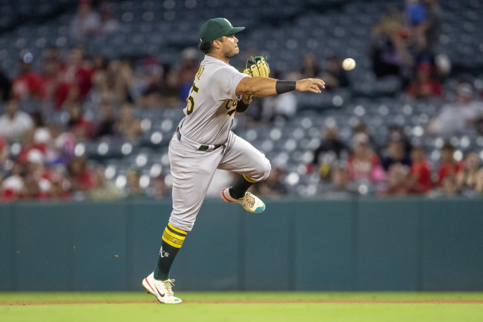 Oakland Athletics second baseman Jordan Diaz throws to first to get Los Angeles Angels' Luis Rengifo on a ground ball out during the first inning of a baseball game in Anaheim, Calif., Wednesday, Sept. 28, 2022. (AP Photo/Alex Gallardo)