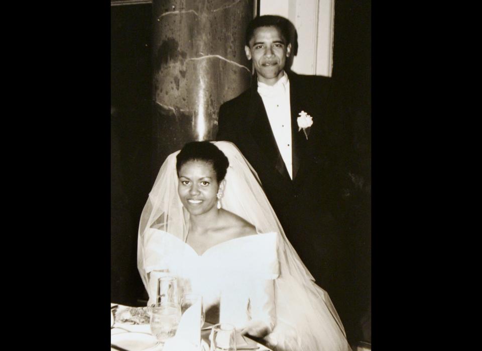 This black-and-white photo released by Obama for America shows President Barack Obama and his bride Michelle Robinson on their wedding day Oct. 18, 1992, in Chicago. After his first year at Harvard, Obama was a summer associate at a corporate law firm in Chicago where his adviser was Robinson, another Harvard law graduate. They later married, and had two daughters, Malia and Sasha. 