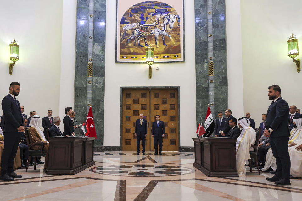 Iraq's Prime Minister Mohammed Shia al-Sudani, center right, and Turkey's President Recep Tayyip Erdogan next to him, attend the signing session of the "Development Road" framework agreement on security, economy and development in Baghdad, Monday, April 22, 2024. (Ahmad Al-Rubaye /Pool Photo via AP)