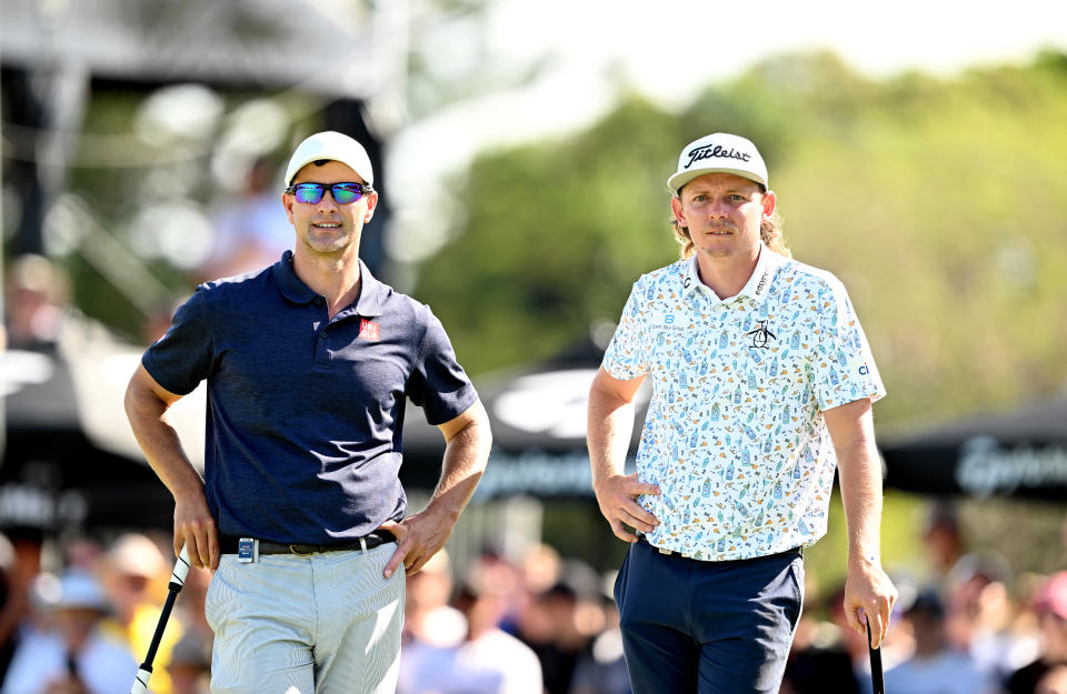 Adam Scott and Cameron Smith examine the green at the Australian Open.