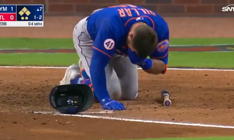 Kevin Pillar on the ground after being hit in the face during a New York Mets - Atlanta Braves game.