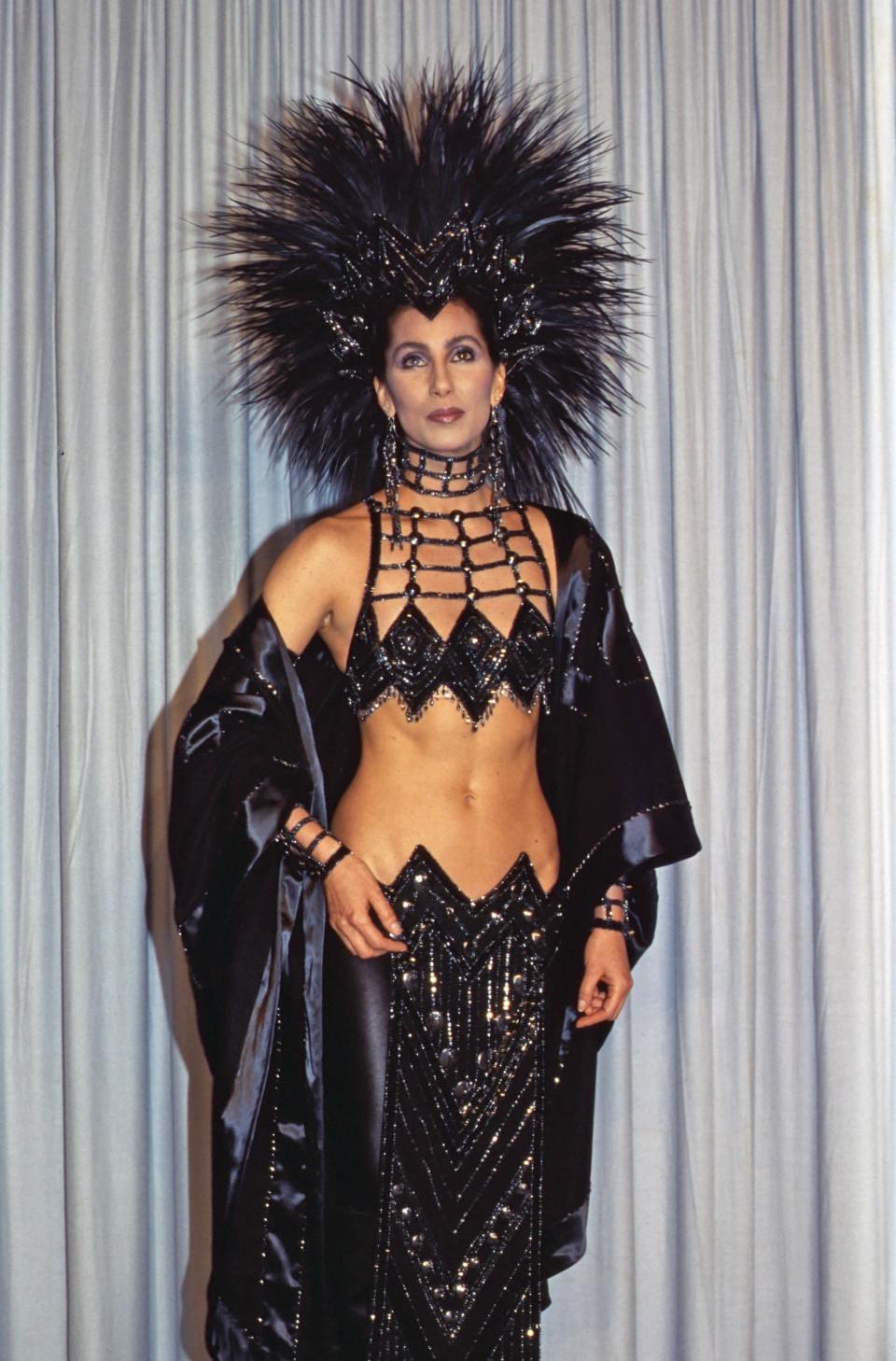 Cher in 1986, wearing an outfit by Bob MackieShutterstock