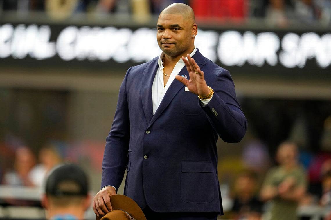 Richard Seymour waves while being honored for the Pro Football Hall of Fame during the first half of the NFL Super Bowl 56 football game between the Los Angeles Rams and the Cincinnati Bengals Sunday, Feb. 13, 2022, in Inglewood, Calif.