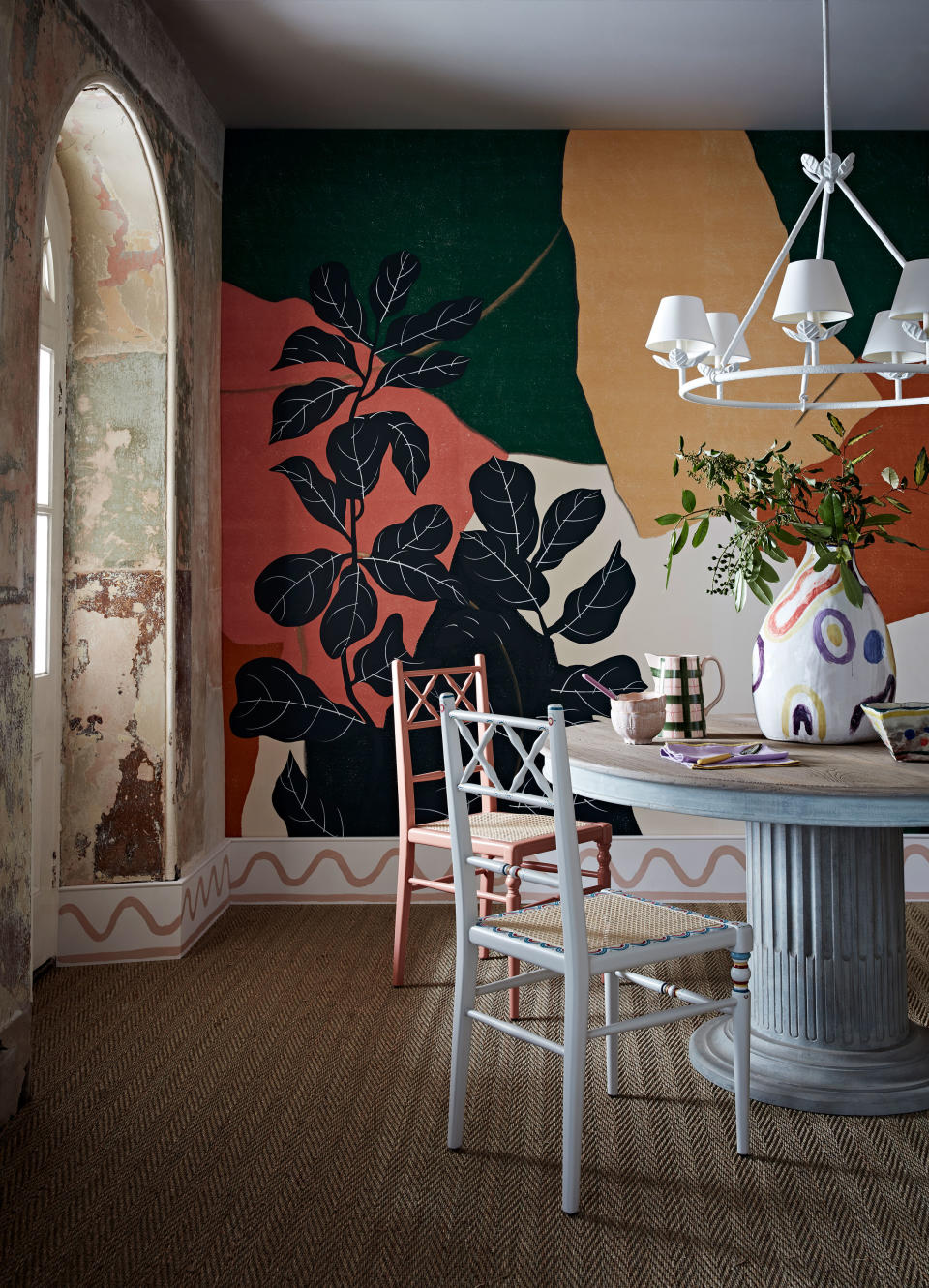 <p> If you are considering really stand-out&#xA0;dining room color schemes, you can introduce contrast with painted furniture. </p> <p> &apos;We chose this extraordinary hand-painted wallcovering design by&#xA0;Fromental&#xA0;for one of our decorating shoots and wanted to add an element of surprise to the dining room set with an unexpected accent color,&apos; says Emma Thomas,&#xA0;<em>Homes &amp; Gardens</em>&apos; Decorating Editor. &apos;We felt this pale blue on the table pedestal and dining chair, plus the salmon pink were perfect opposites for the deeper, bolder colors on the wall. This same effect could be achieved with painted furniture ideas.&apos; </p>
