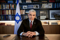 In this Thursday, May 21, 2020 file photo, Israel's opposition leader Yair Lapid poses for a photo at his office in Tel Aviv, Israel, Thursday, May 21, 2020. Israel's President Reuven Rivlin has tapped Lapid to form a new government, a step that could lead to the end of the lengthy rule of Prime Minister Benjamin Netanyahu. Rivlin announced his decision on live television a day after Netanyahu failed to cobble together a governing coalition by a midnight deadline. (AP Photo/Oded Balilty, File)