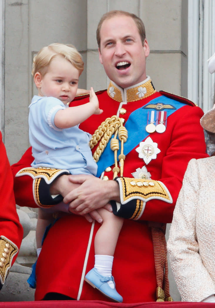 LONDON, UNITED KINGDOM - JUNE 13: (EMBARGOED FOR PUBLICATION IN UK NEWSPAPERS UNTIL 48 HOURS AFTER CREATE DATE AND TIME) Prince William, Duke of Cambridge carries his son Prince George of Cambridge as he stands on the balcony of Buckingham Palace during Trooping the Colour on June 13, 2015 in London, England. The ceremony is Queen Elizabeth II's annual birthday parade and dates back to the time of Charles II in the 17th Century, when the Colours of a regiment were used as a rallying point in battle. (Photo by Max Mumby/Indigo/Getty Images)