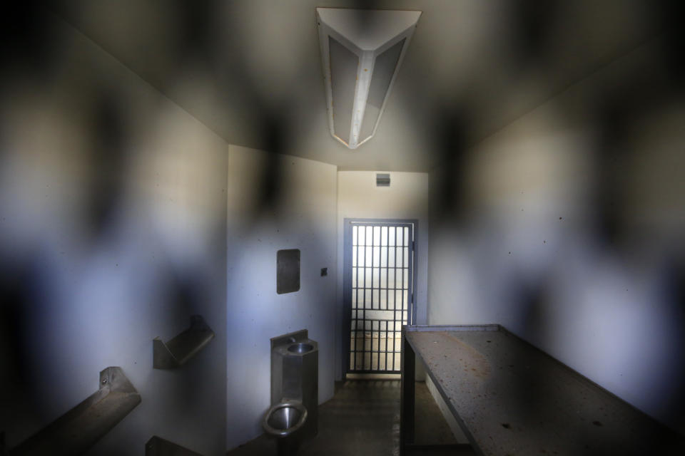 A two-person cell is seen through a gate at the Laguna del Toro maximum security facility during a media tour of the now closed Islas Marias penal colony located off Mexico's Pacific coast, Saturday, March 16, 2019. Bars and cells were limited to the maximum security facility because the surrounding ocean effectively prevented escape. (AP Photo/Rebecca Blackwell)