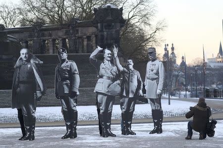 Activists placed life-size cardboards, depicting Benito Mussolini, Adolf Hitler, Josef Stalin, Francisco Franko and Philippe Petain in front of the Kaiser Wilhelm monument at the Deutsches Eck ("German Corner") to protest against a European far-right leaders meeting, in Koblenz, Germany, January 21, 2017. REUTERS/Kai Pfaffenbach