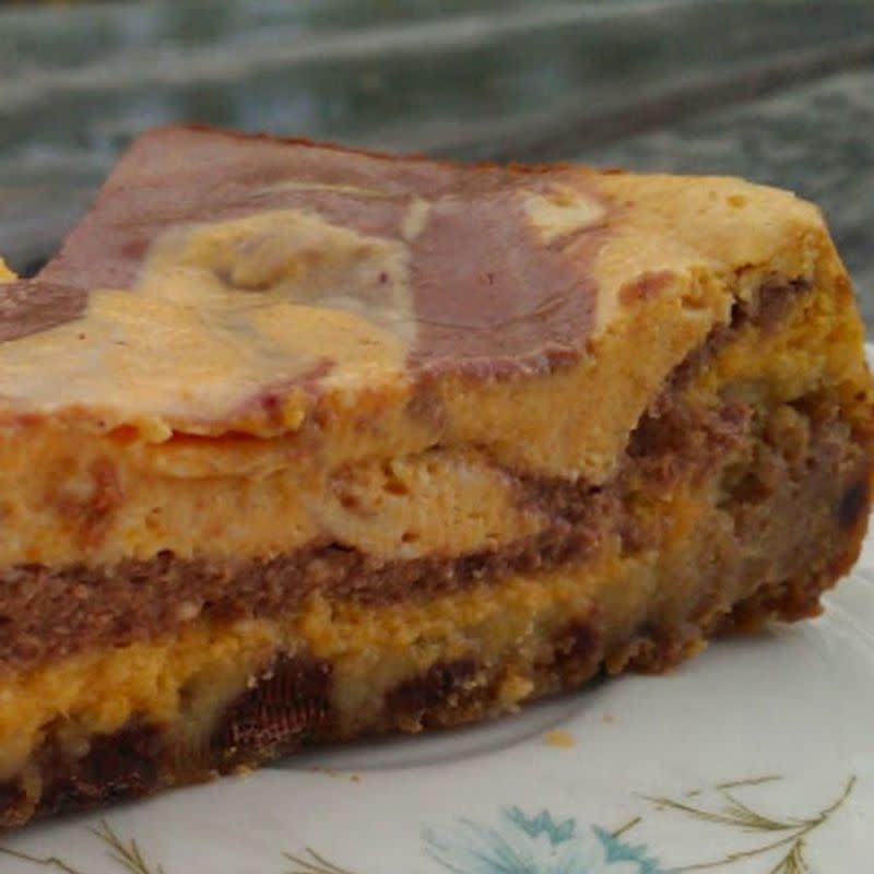 <p>Chocolatetess</p><p>Pumpkin and chocolate swirled together in this creamy, luscious cheesecake with a chocolate chip cookie dough crust!</p><p><strong>Get the recipe: <a href="https://www.thebakingchocolatess.com/pumpkin-chocolate-swirl-cheesecake-chocolate-chip-cookie-crust/" rel="nofollow noopener" target="_blank" data-ylk="slk:Pumpkin & Chocolate Swirl Cheesecake;elm:context_link;itc:0;sec:content-canvas" class="link ">Pumpkin & Chocolate Swirl Cheesecake</a></strong></p>