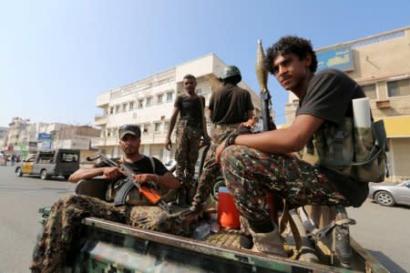 FILE PHOTO: Houthi militants patrol a street where pro-Houthi protesters demonstrated against the Saudi-led coalition in Hodeidah, Yemen December 10, 2018. Picture taken December 10, 2018. REUTERS/Abduljabbar Zeyad/File Photo