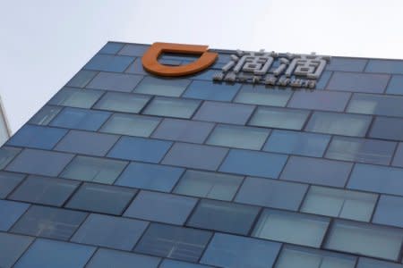 FILE PHOTO: Logo of Didi Chuxing is seen at its headquarters building in Beijing, China, May 18, 2016. REUTERS/Kim Kyung-Hoon