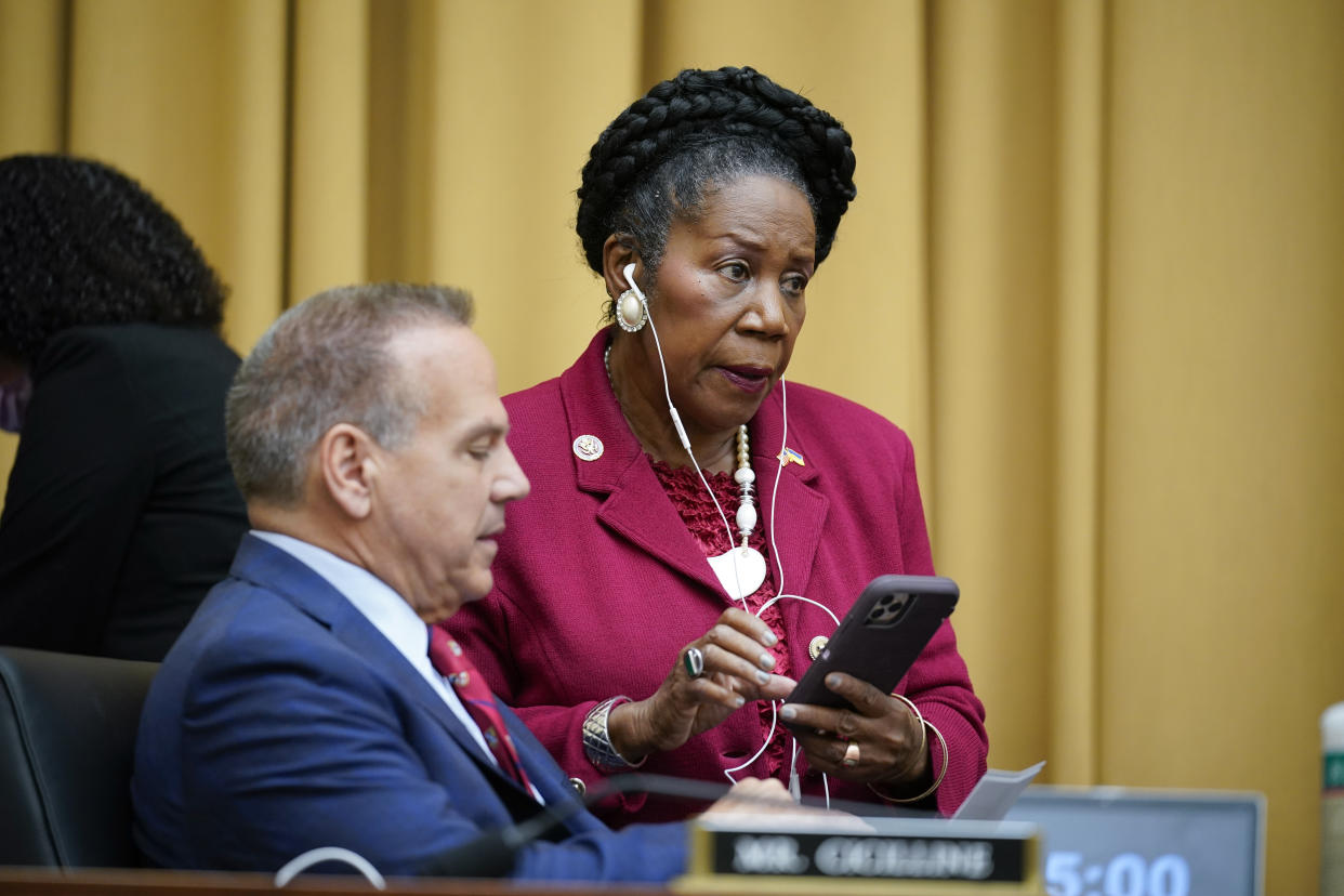 Rep. David Cicilline, D-R.I., left, and Rep. Sheila Jackson Lee, D-Texas, confer as the House Judiciary Committee holds an emergency meeting to advance a series of Democratic gun control measures, called the Protecting Our Kids Act, in response to mass shootings in Texas and New York, at the Capitol in Washington, Thursday, June 2, 2022. (AP Photo/J. Scott Applewhite)