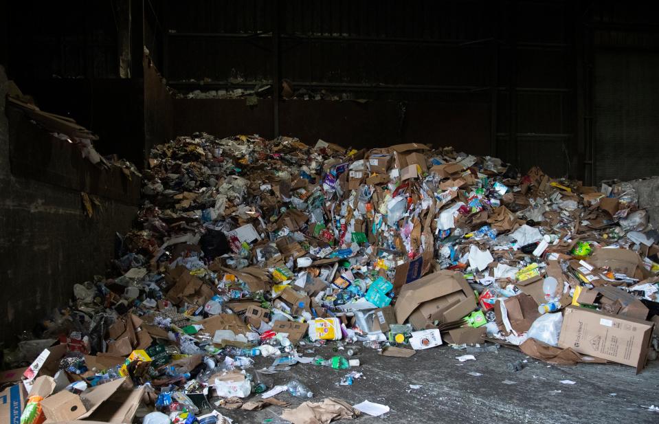 A pile of recyclable materials sits awaiting sorting, Tuesday, March 26, 2024, at the Tippecanoe County Solid Waste District in Lafayette, Ind.