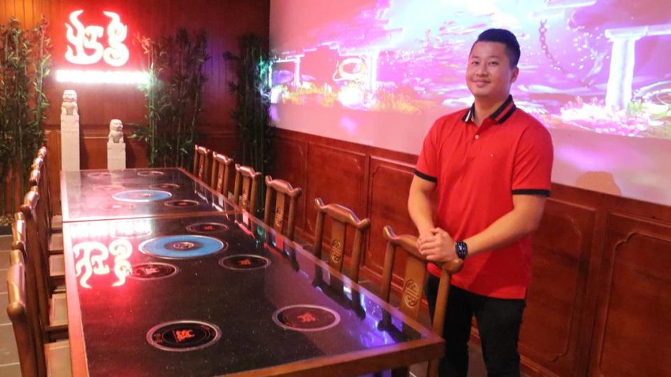 Hong BBQ & Hot Pot​ opens Tuesday, Aug. 8, at 445 Cortez Road W., in Bradenton’s Orange Blossom Plaza. General manager Tom Kuo is shown in one of the VIP rooms, featuring a wall-length projection screen.