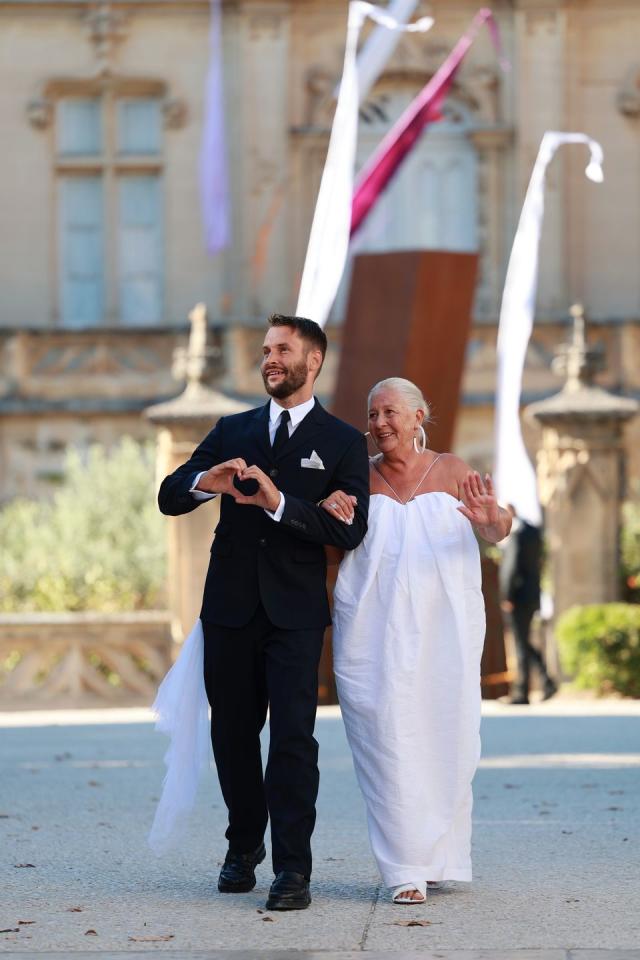 Dua Lipa wore a sheer white dress with a bandeau bra and thigh-high slit to  a wedding in France - Yahoo Sports