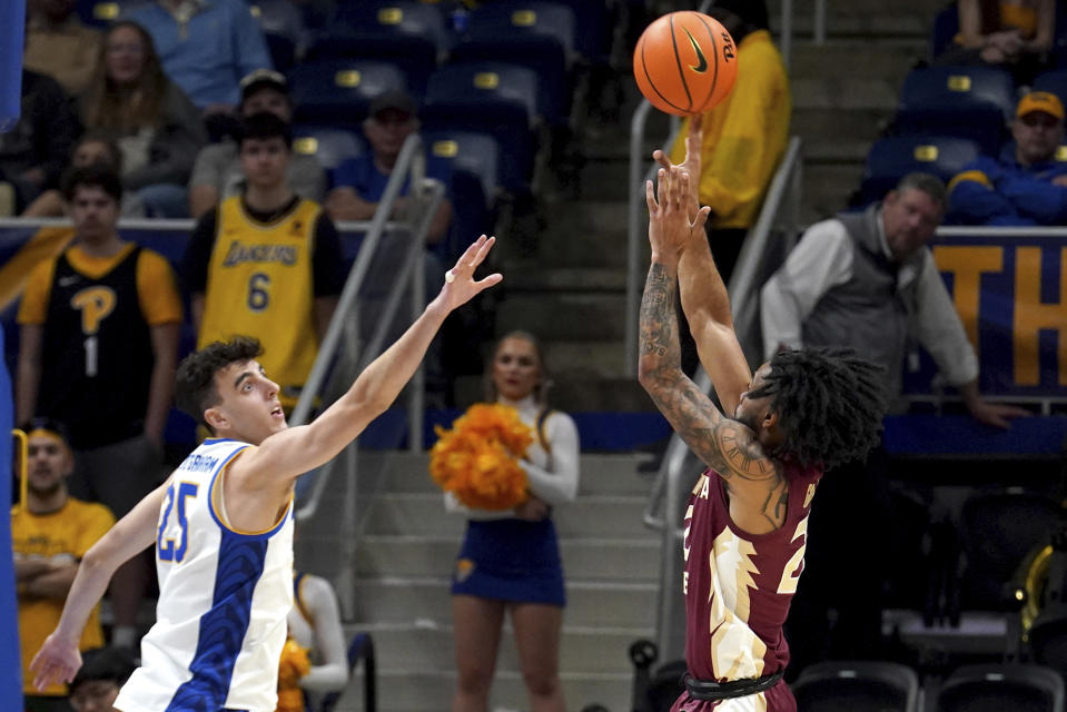 Florida State's Darin Green Jr. (22) shoots over Pittsburgh's Guillermo Diaz Graham (25) during the second half of an NCAA college basketball game Tuesday, March 5, 2024, in Pittsburgh. (AP Photo/Matt Freed)