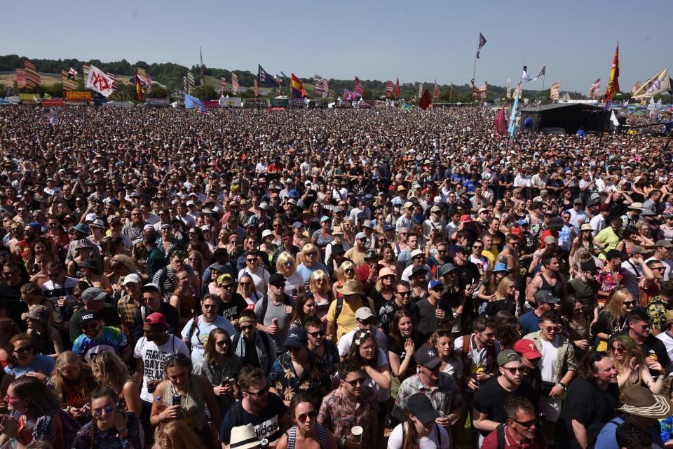 Festival-goers gather in the morning sunshine at the Other Stage to see The Vaccines on the third day of the Glastonbury Festival of Music and Performing Arts on Worthy Farm near the village of Pilton in Somerset, South West England, on June 28, 2019. (Photo by Oli SCARFF / AFP)        (Photo credit should read OLI SCARFF/AFP via Getty Images)