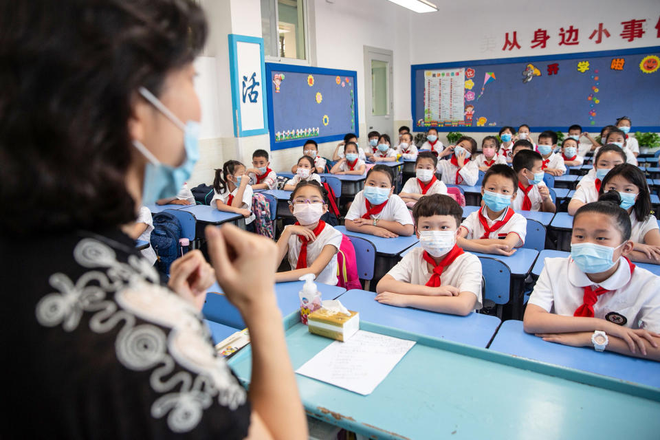 Image: Elementary school students attending a class on the first day of the new semester in Wuhan in China's central Hubei province. (AFP via Getty Images file)