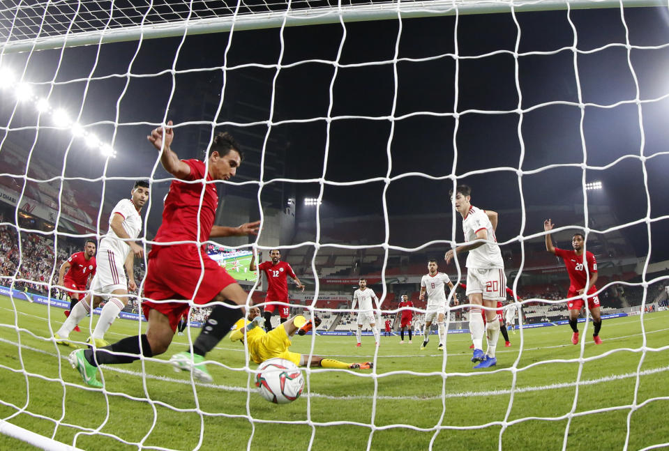 Iran's forward Sardar Azmoun, second right, shoots to score his side's fourth goal during the AFC Asian Cup group D soccer match between Iran and Yemen at the Mohammed Bin Zayed Stadium in Abu Dhabi, United Arab Emirates, Monday, Jan. 7, 2019. (AP Photo/Hassan Ammar)