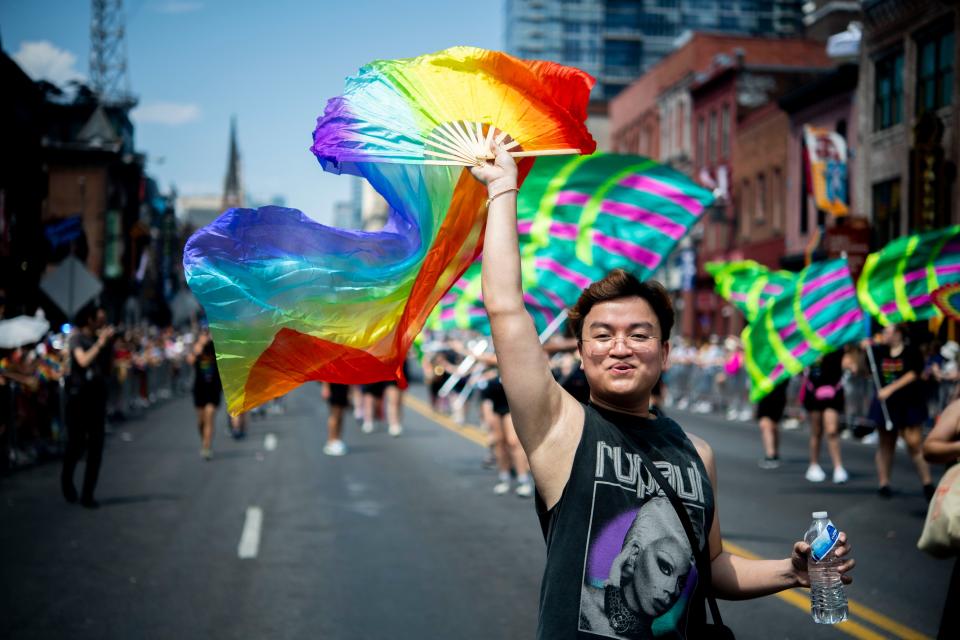 Bing Ngo, walks in the 2024 Pride parade downtown on Broadway in Nashville , Tenn., Saturday, June 22, 2024.