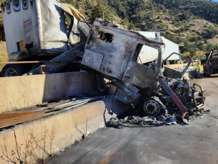 Crashed commercial motor vehicle on I-70 in Glenwood Canyon at Mile Point 119 on Oct. 12, 2022. Guardrail was damaged by the crash. The CMV was traveling westbound.