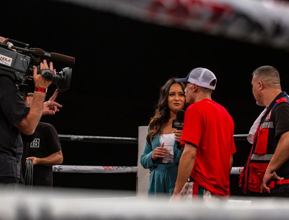 Sports anchor Brandy Flores interviews Manuel Flores of Coachella, Calif., after winning his super bantamweight fight at Fantasy Springs Resort Casino in Indio, Calif., Thursday, July 28, 2022. 
