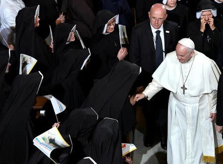 Pope Francis is greeted by nuns during a visit to the Sanctuary of Divine Mercy in Krakow, Poland July 30, 2016. REUTERS/Daniel Dal Zennaro/Pool