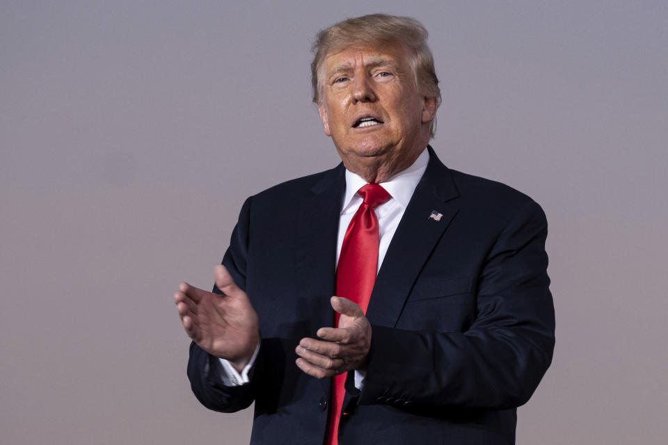 FILE - Former President Donald Trump prepares to take the stage during his Save America rally in Perry, Ga., on Sept. 25, 2021. Trump said he would endorse Alaska Gov. Mike Dunleavy for reelection, but only if the governor doesn't back U.S. Sen. Lisa Murkowski's bid to return to the Senate. (AP Photo/Ben Gray, File)