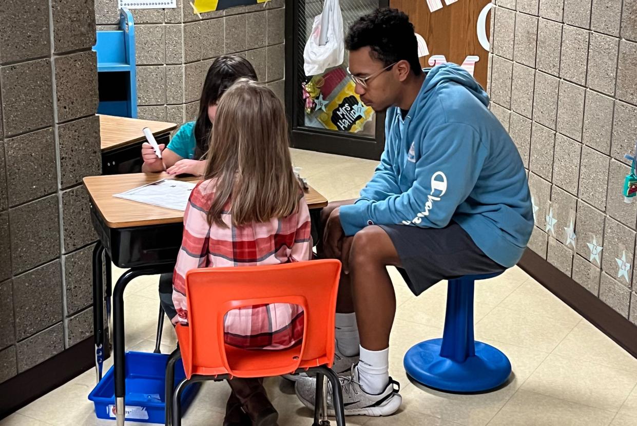 Roosevelt High School senior Dashawn Sykes works with Oscar Howe Elementary students as part of his Teacher Pathway training in Sioux Falls. Sykes has plans to become a math teacher.