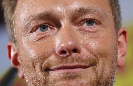 Free Democratic Party FDP leader Christian Lindner reacts on first exit polls in the German general election (Bundestagswahl) in Berlin, Germany, September 24, 2017. REUTERS/Ralph Orlowski