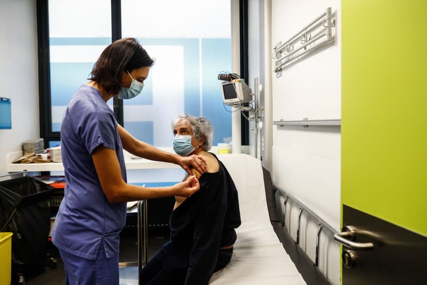 TOPSHOT - A nurse administers a dose of the Pfizer-BioNTech Covid-19 vaccine at the hospital Hotel-Dieu in Paris, on January 2, 2021 as a vaccination campaign for healthcare workers aged 50 years and more has been launched at this hospital. (Photo by Sameer Al-DOUMY / AFP) (Photo by SAMEER AL-DOUMY/AFP via Getty Images)