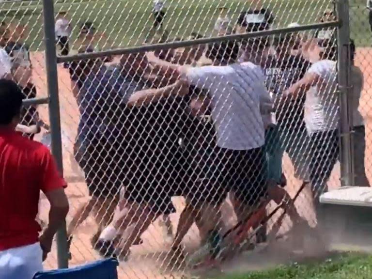 Police have launched a manhunt after a mass brawl broke out among parents watching a baseball game between a group of 7-year-olds.Footage of the fight shows several adults fighting among themselves, in Lakewood, Colorado.They were apparently “unhappy” with the game and the judgement of a 13-year-old umpire, Lakewood Police Department said.The force appealed for information about the identity of a man wearing a white shirt and blue shorts, who can be seen punching another man in the back of the head and sending him tumbling to the ground.Several people were injured and one was badly hurt, the department added. Several of those involved received citations for disorderly conduct and fighting in public, John Romero, a spokesman for Lakewood police, told The Washington Post.He said the brawl began after adults argued over a ruling “one side didn’t like”.Mr Romero said the man in a white T-shirt and blue shorts could face an assault charge.Other adults could face similar charges in addition to child abuse charges if they are found to have put any children in danger, he added.