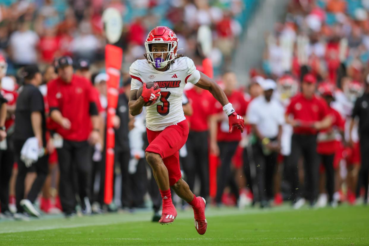 Louisville Cardinals wide receiver Kevin Coleman (3) runs for a touchdown against the Miami Hurricanes during the fourth quarter at Hard Rock Stadium.