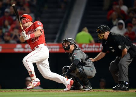 June 19, 2018; Anaheim, CA, USA; Los Angeles Angels designated hitter Mike Trout (27) a two run RBI single in the fifth inning against the Arizona Diamondbacks at Angel Stadium of Anaheim. Mandatory Credit: Gary A. Vasquez-USA TODAY Sports