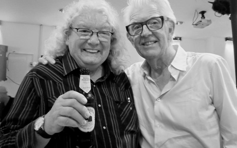 Allan Jones enjoying a rare drink with Nick Lowe - Courtesy of Allan Jones