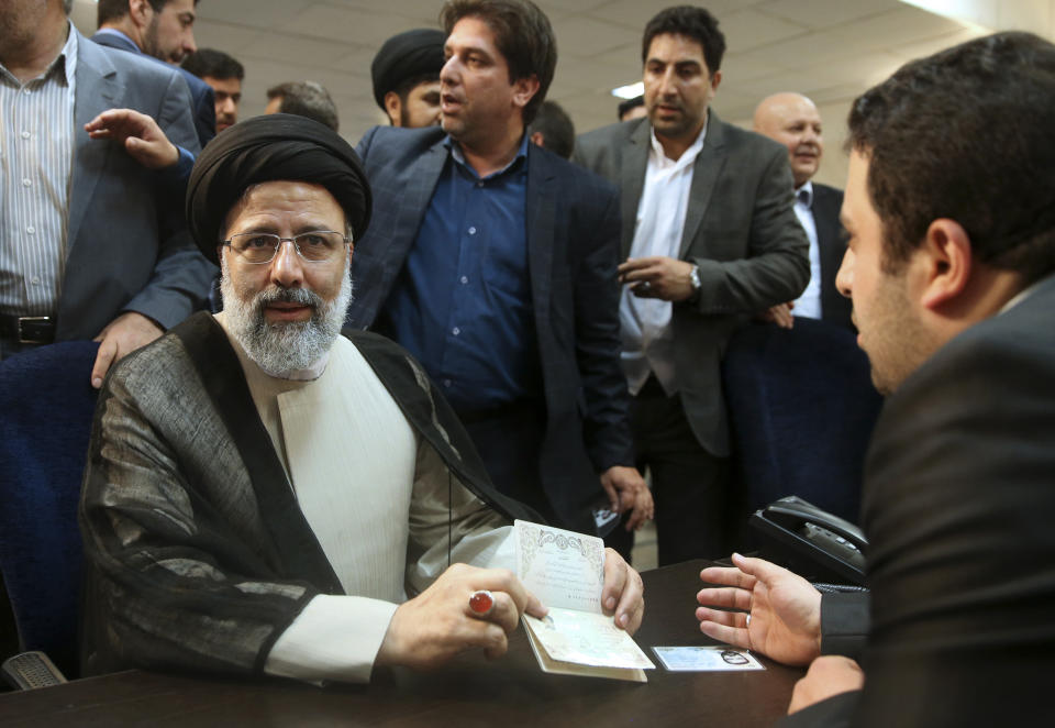 In this April 14, 2017 photo, hard-line cleric Ebrahim Raisi registers his candidacy for the May 2017 presidential election, in Tehran, Iran. On Thursday March 7, 2019, Iran's Supreme Leader Ayatollah Ali Khamenei named Raisi as the country's new judiciary chief. That’s sparked concern from rights activists over his involvement in the execution of thousands in the 1980s. Raisi’s selection comes after he was trounced by incumbent Hassan Rouhani in the country’s 2017 presidential election. (AP Photo/Vahid Salemi)