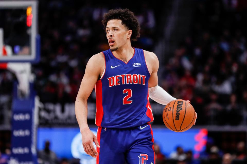 Detroit Pistons guard Cade Cunningham looks to pass against the Chicago Bulls during the second half at Little Caesars Arena in Detroit on Wednesday, March 9, 2022.