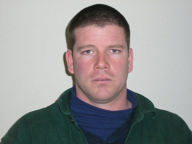 Sean J. Brennan in a mug shot provided by police a decade ago.