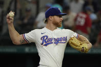 Texas Rangers starting pitcher Jon Gray throws during the first inning of the first baseball game of a doubleheader against the New York Yankees in Arlington, Texas, Tuesday, Oct. 4, 2022. (AP Photo/LM Otero)