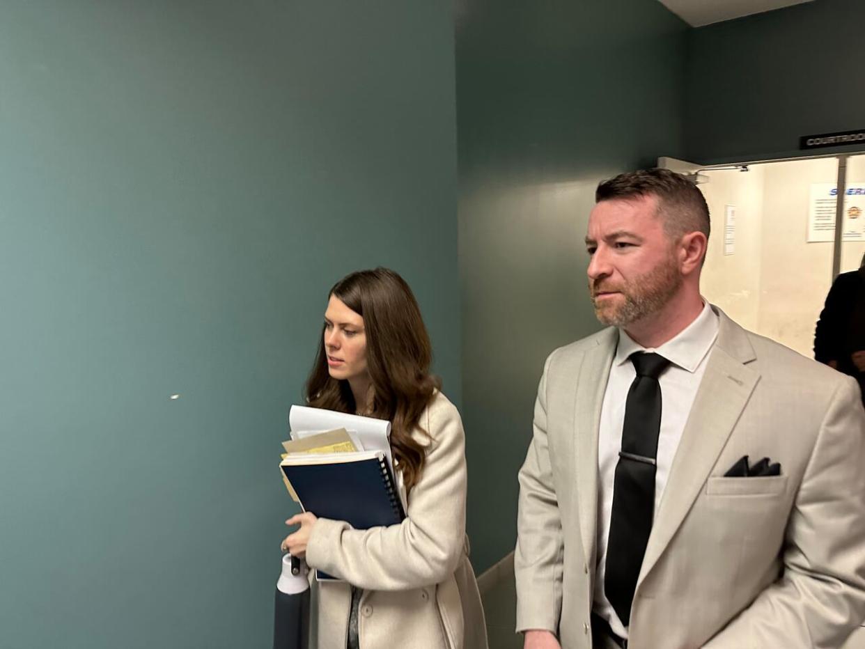 Jeremy MacKenzie, right, and Morgan Guptill are shown on Tuesday, April 30, 2024, outside a provincial courtroom in Dartmouth, N.S. (Richard Cuthbertson/CBC - image credit)