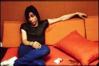 <p>Iggy Pop lounges backstage in 1980 with a pack of cigarettes. The musician, who was the lead singer of the '60s band The Stooges, is known as the "Godfather of Punk."</p>