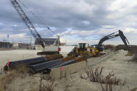 Construction equipment and material sits on the beach in North Wildwood, N.J. on Jan. 5, 2023. On Feb. 1, 2023, a judge denied the city permission to build a bulkhead to protect against erosion, but allowed it to move forward with a $21 million lawsuit seeking damages from the state to recoup the cost of sand the city trucked in at its own expense in the absence of a state and federal beach replenishment project. (AP Photo/Wayne Parry)