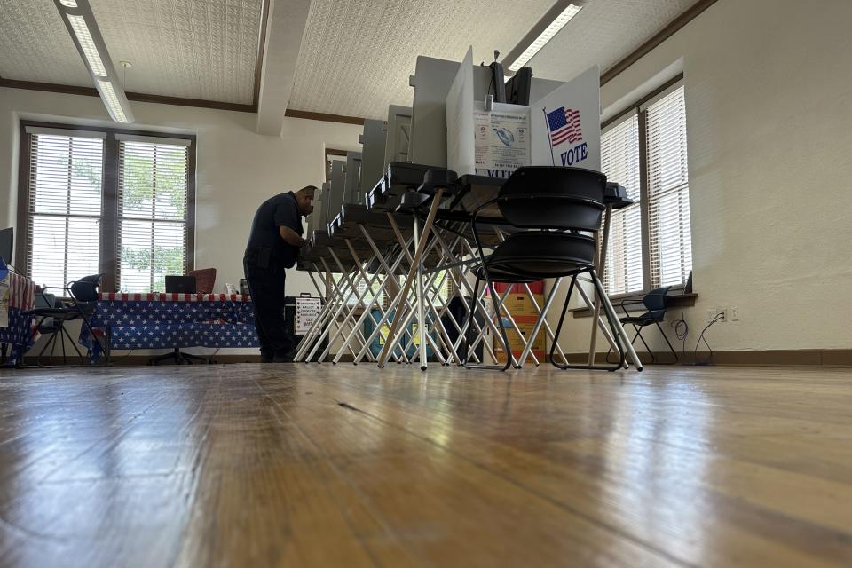 A voter casts his ballot at a polling location in Bernalillo, N.M., on Tuesday, June 4, 2024. New Mexico voters are picking their partisan favorites in Tuesday's primary to reshape a Democratic-led Legislature, with all 112 seats up for election in November. (AP Photo/Susan Montoya Bryan)