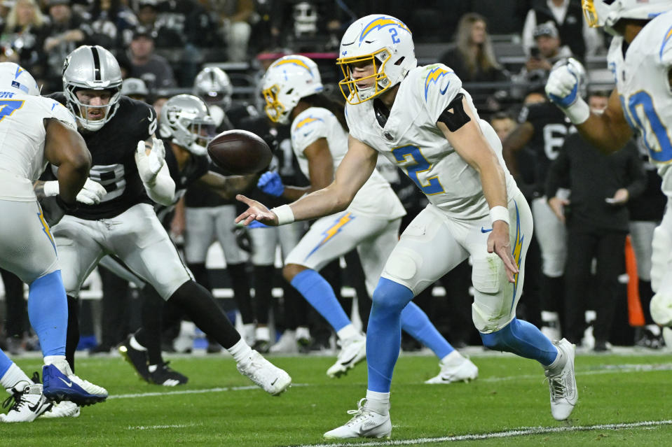 Los Angeles Chargers quarterback Easton Stick (2) throws a pass against the Las Vegas Raiders during the first half of an NFL football game, Thursday, Dec. 14, 2023, in Las Vegas. (AP Photo/David Becker)