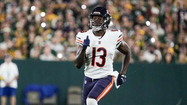 Chicago Bears wide receiver Byron Pringle (13) pulls the ball away from New  York Jets cornerback D.J. Reed (4) for a touchdown catch during the first  quarter of an NFL football game