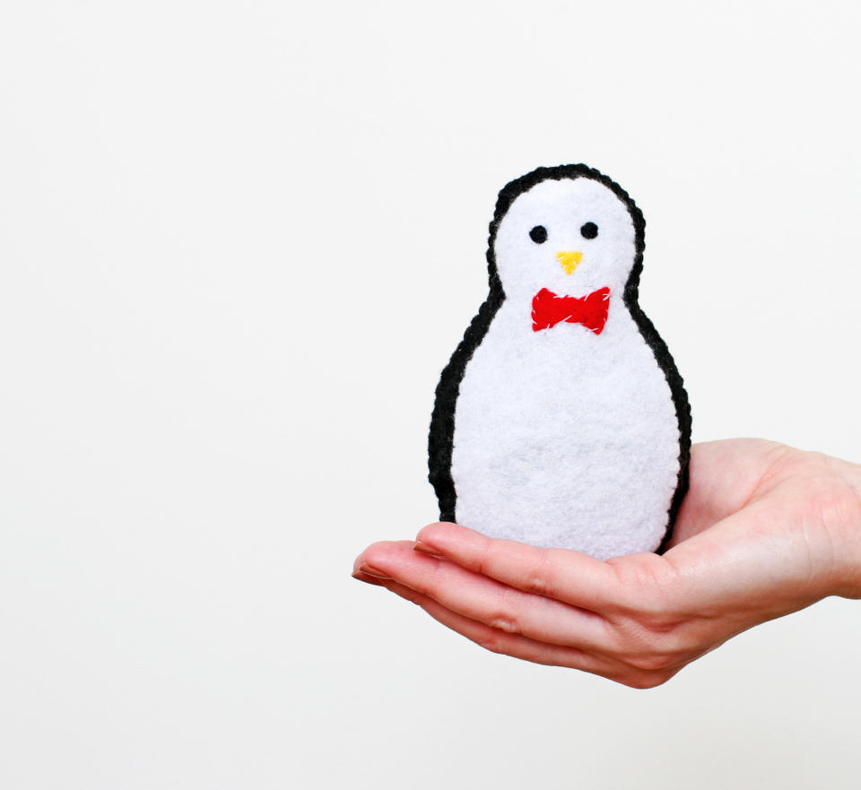 This undated publicity photo provided by Quirk Books shows Sarah Goldschadt's Plush Penguin made of felt, whose template can be used to make several paper crafts. The holiday doldrums are just the thing for unleashing children's creativity. If they can wield a pair of scissors, kids can make the cute characters in Goldschadt’s book, “Craft-A-Day” (Quirk Books, 2012). (AP Photo/Quirk Books, Sarah Goldschadt)