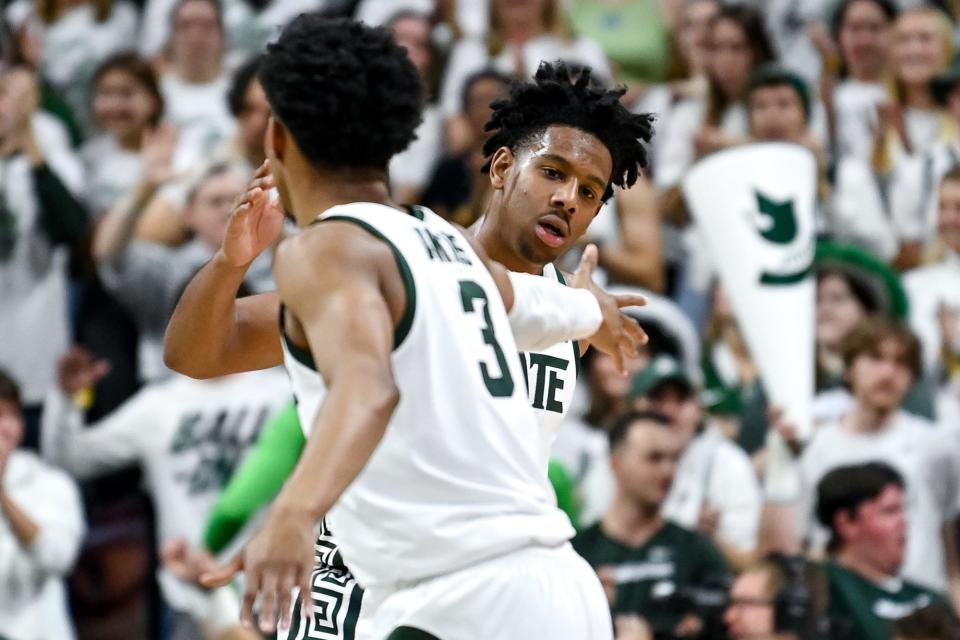 Michigan State's AJ Hoggard, right, celebrates with Jaden Akins during the first half in the game against Villanova on Friday, Nov.  18, 2022, at the Breslin Center in East Lansing.